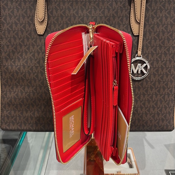 MICHAEL KORS Leather Continental Phone Holder Wristlet Wallet 
Dark Sungria
NWT